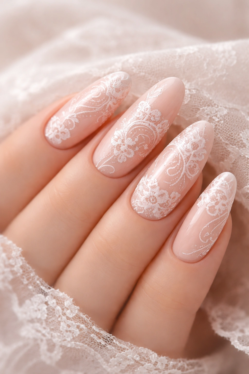 Soft blush nails with delicate white lace details
