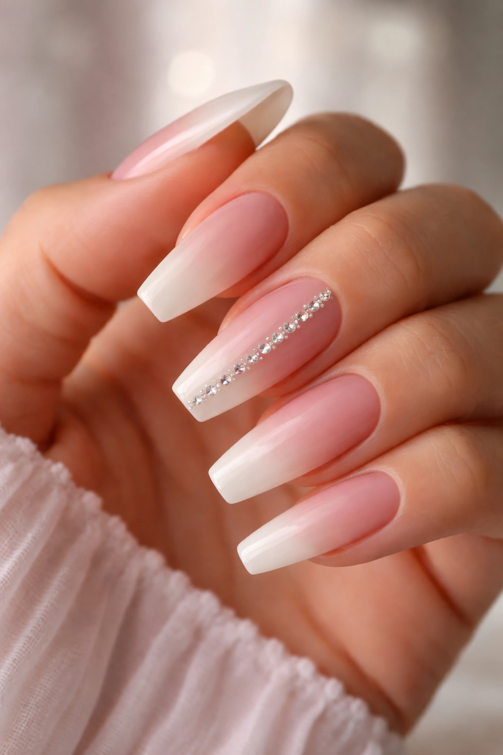 Blush ombre ballerina nails with crystal spine accent nail