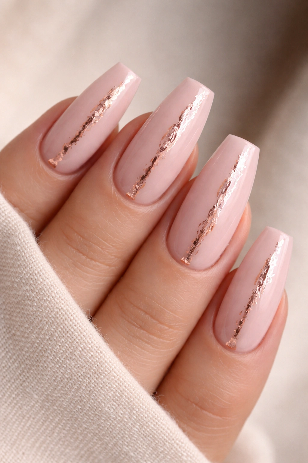 Medium coffin nails in blush pink with rose gold foil accents