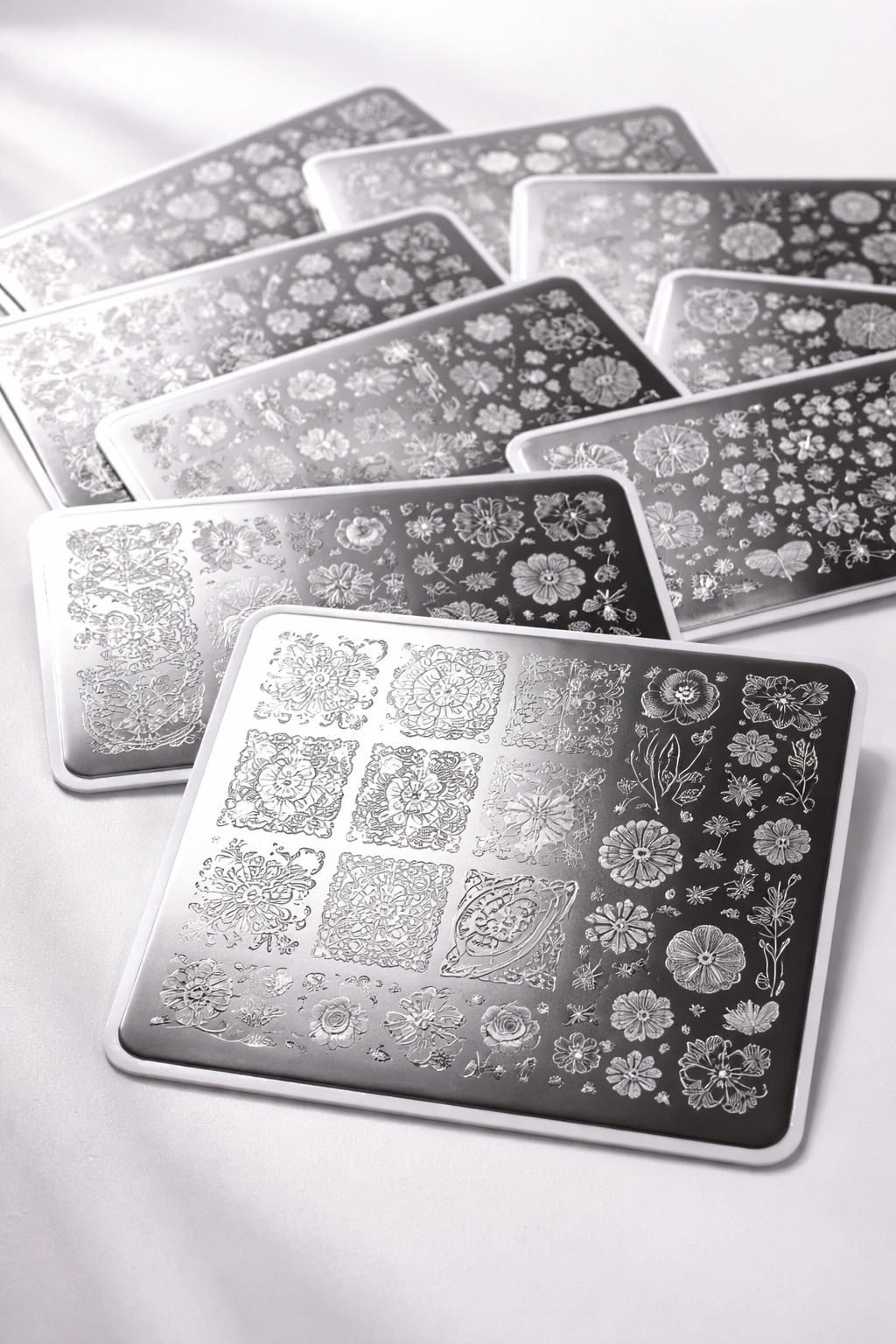 Close-up of Born Pretty stamping plates with crisp etched designs