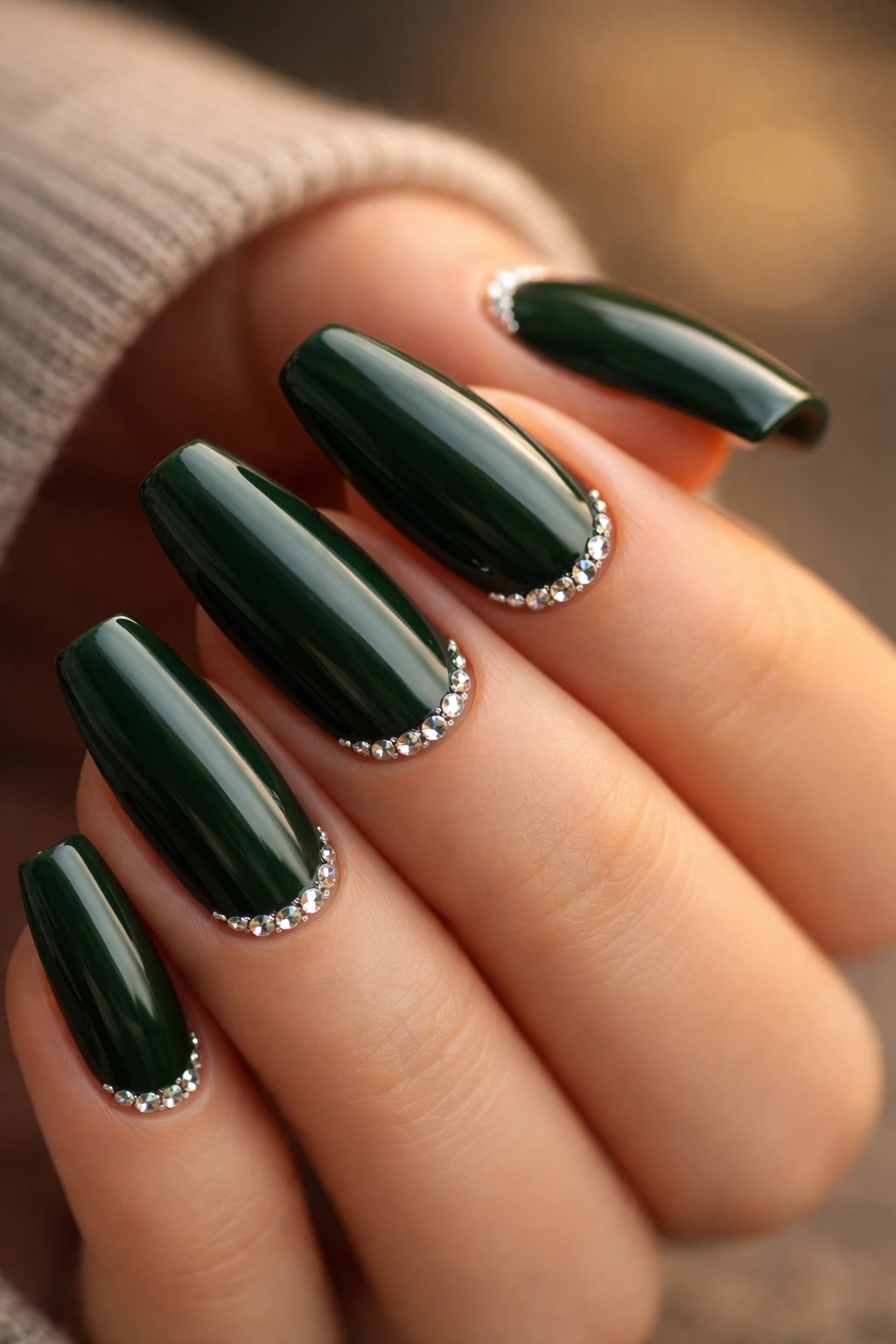 Bottle green nails with tiny crystals at the cuticles