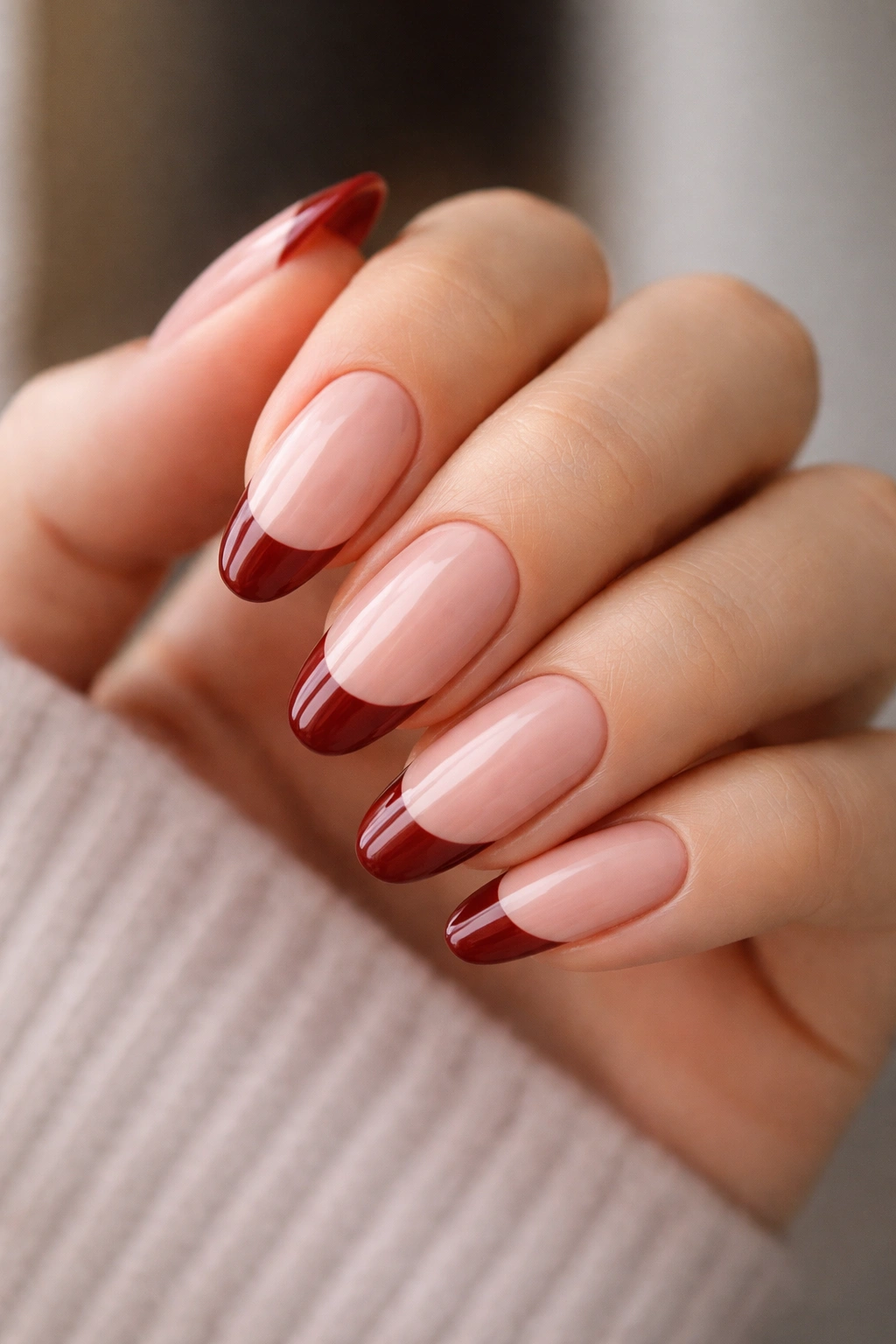 Almond nails with soft squared shape and brick red French tips