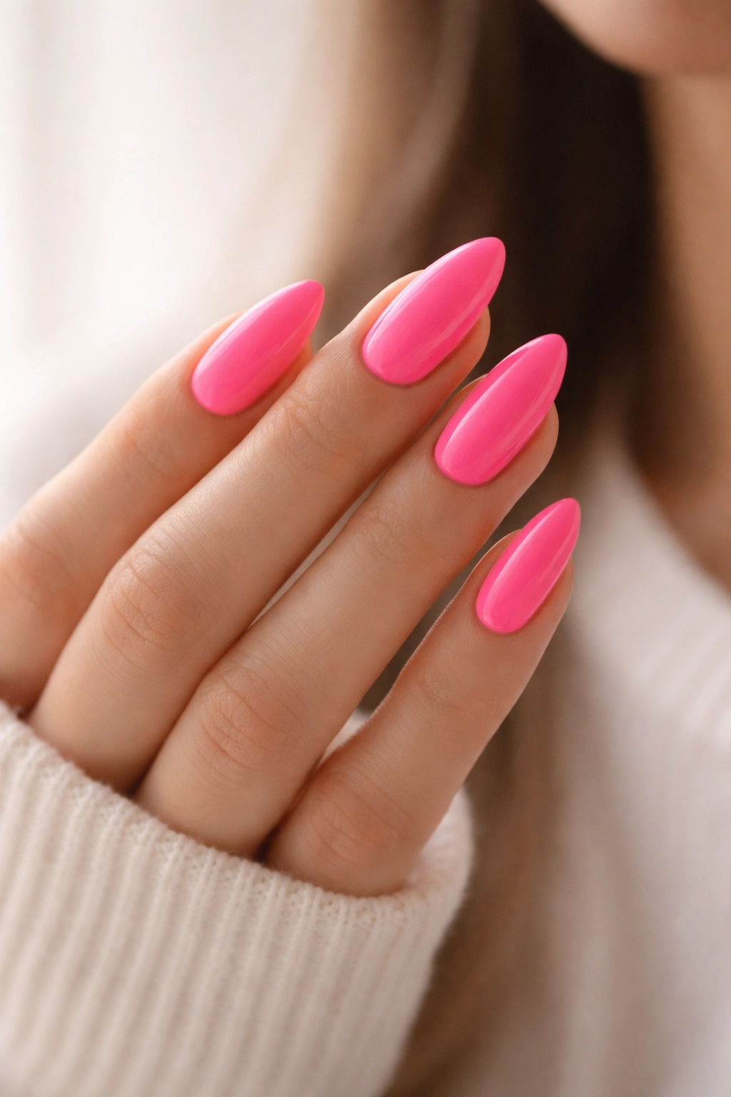 Close-up of bright-colour almond nails on hand with single color.