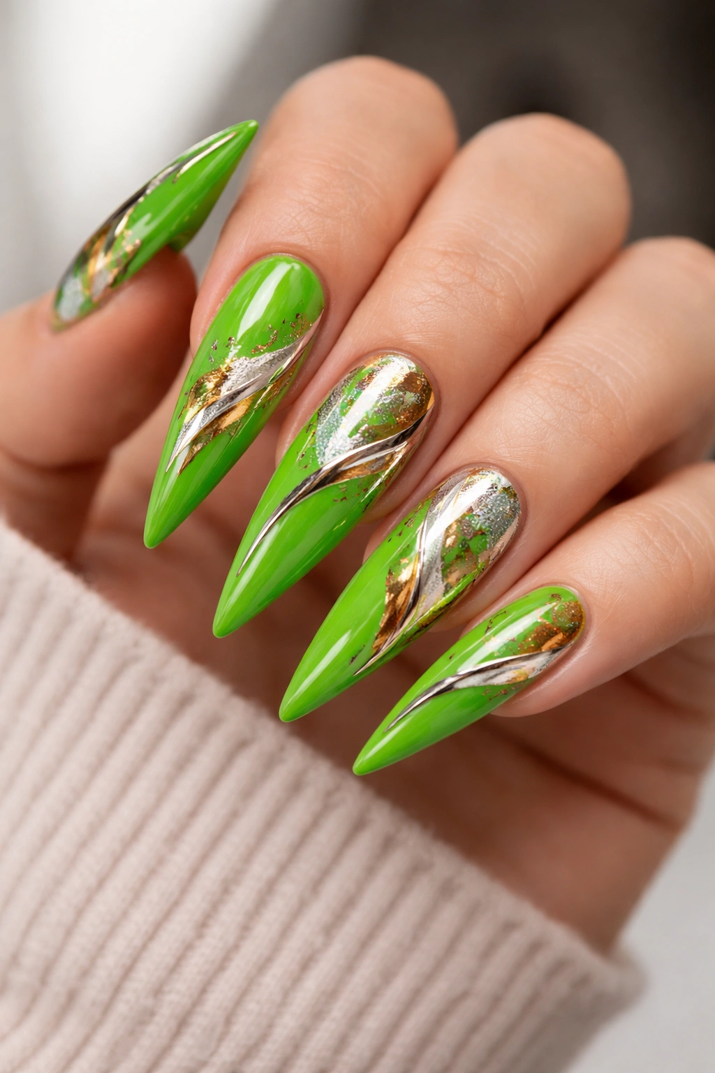 Close-up of bright green nails with mixed metallic accents