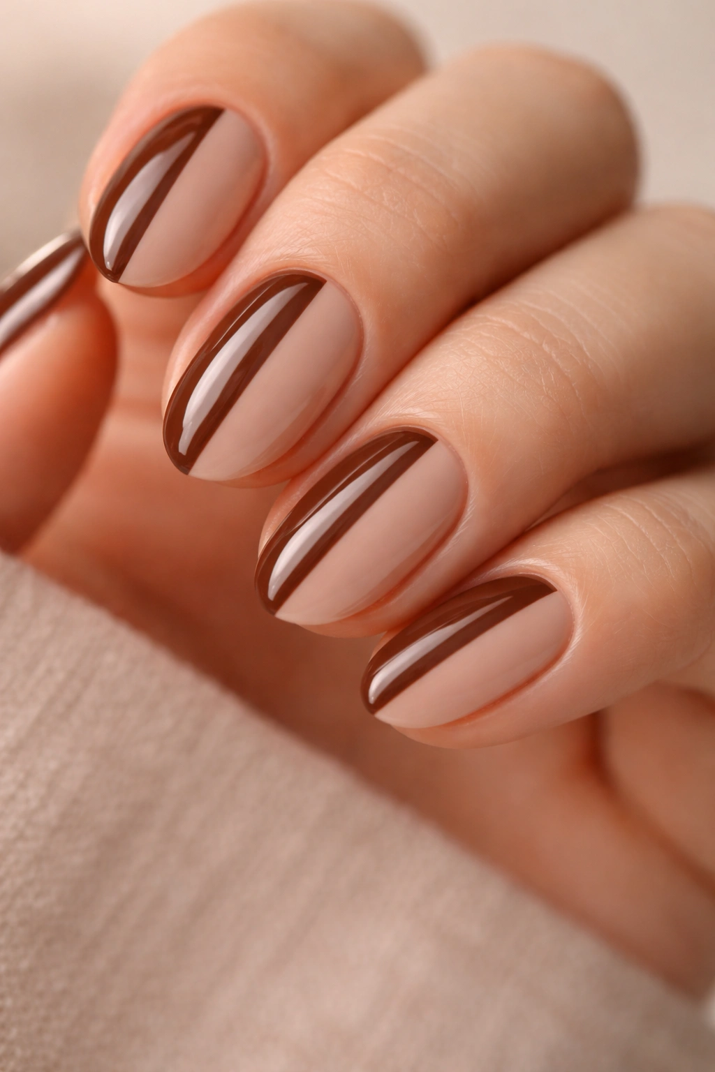 Short almond nails with a brown and nude split design