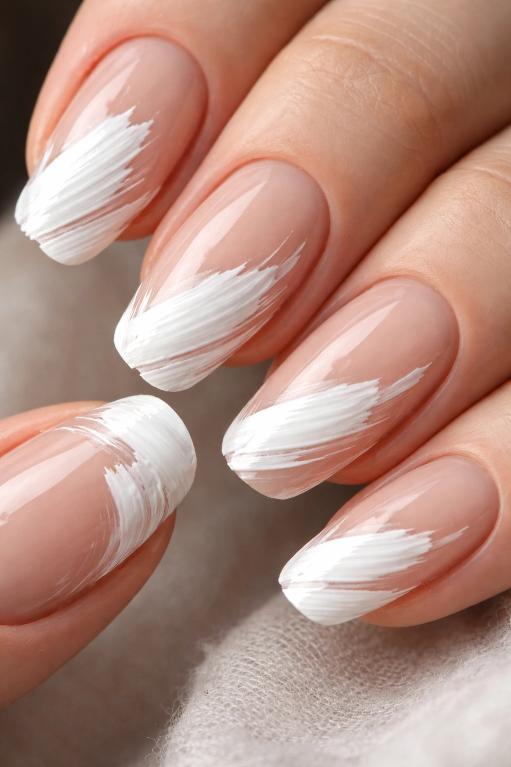 Nails with bold brushstroke French tips showing visible texture and bristle marks