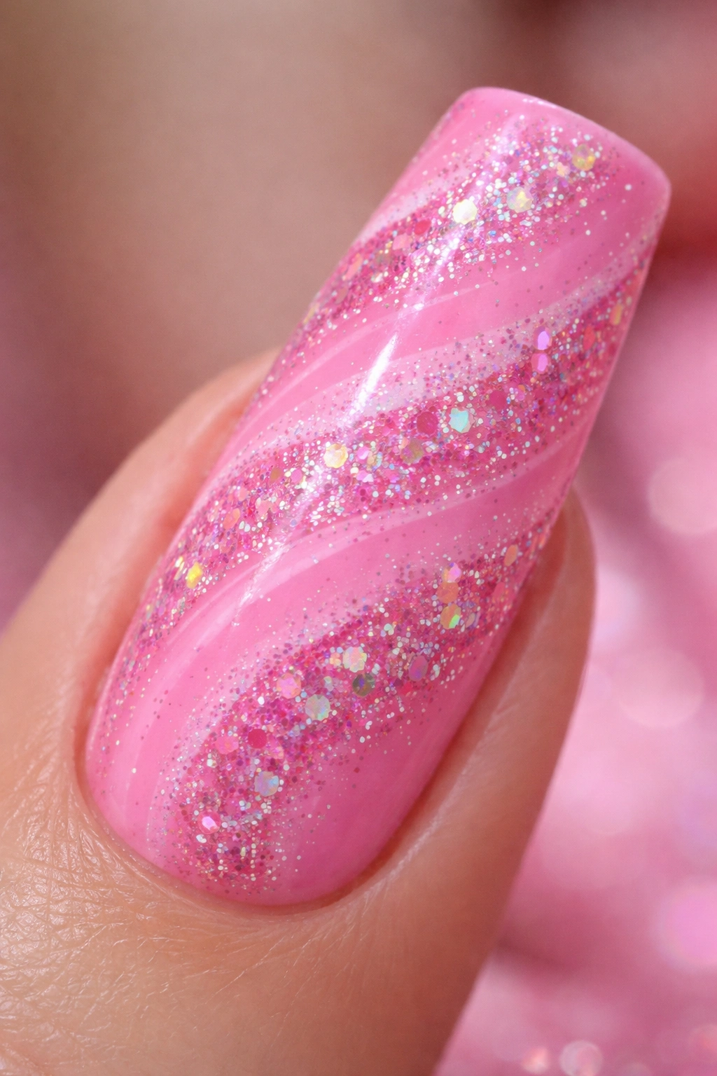 Bubblegum pink duck nail with chunky glitter swirls