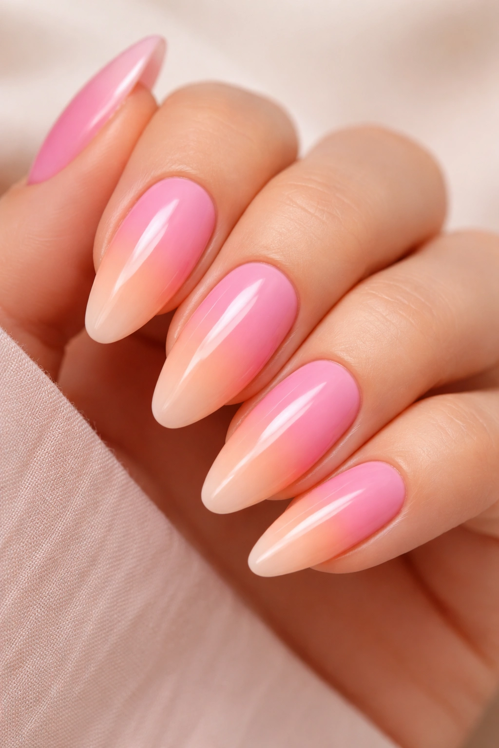 Almond nails bubblegum pink to peach gradient