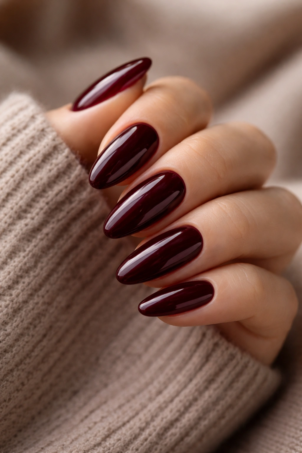 Almond nails in deep burgundy with glossy finish