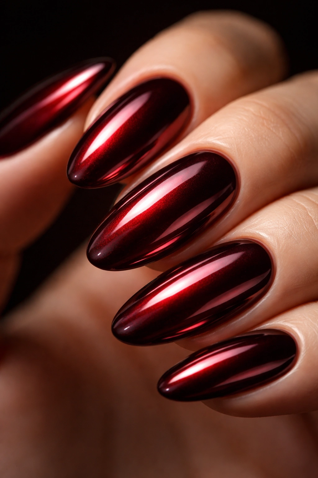 Burgundy chrome nail with deep wine shade and metallic shine