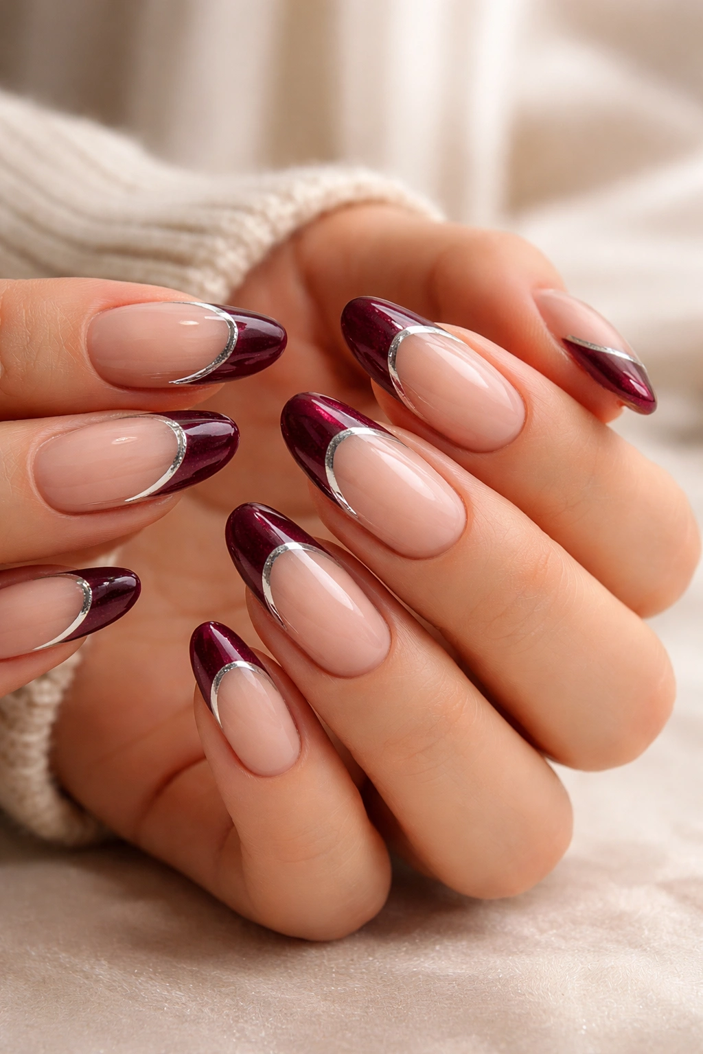 Nails with burgundy French tips and velvet/chrome textures
