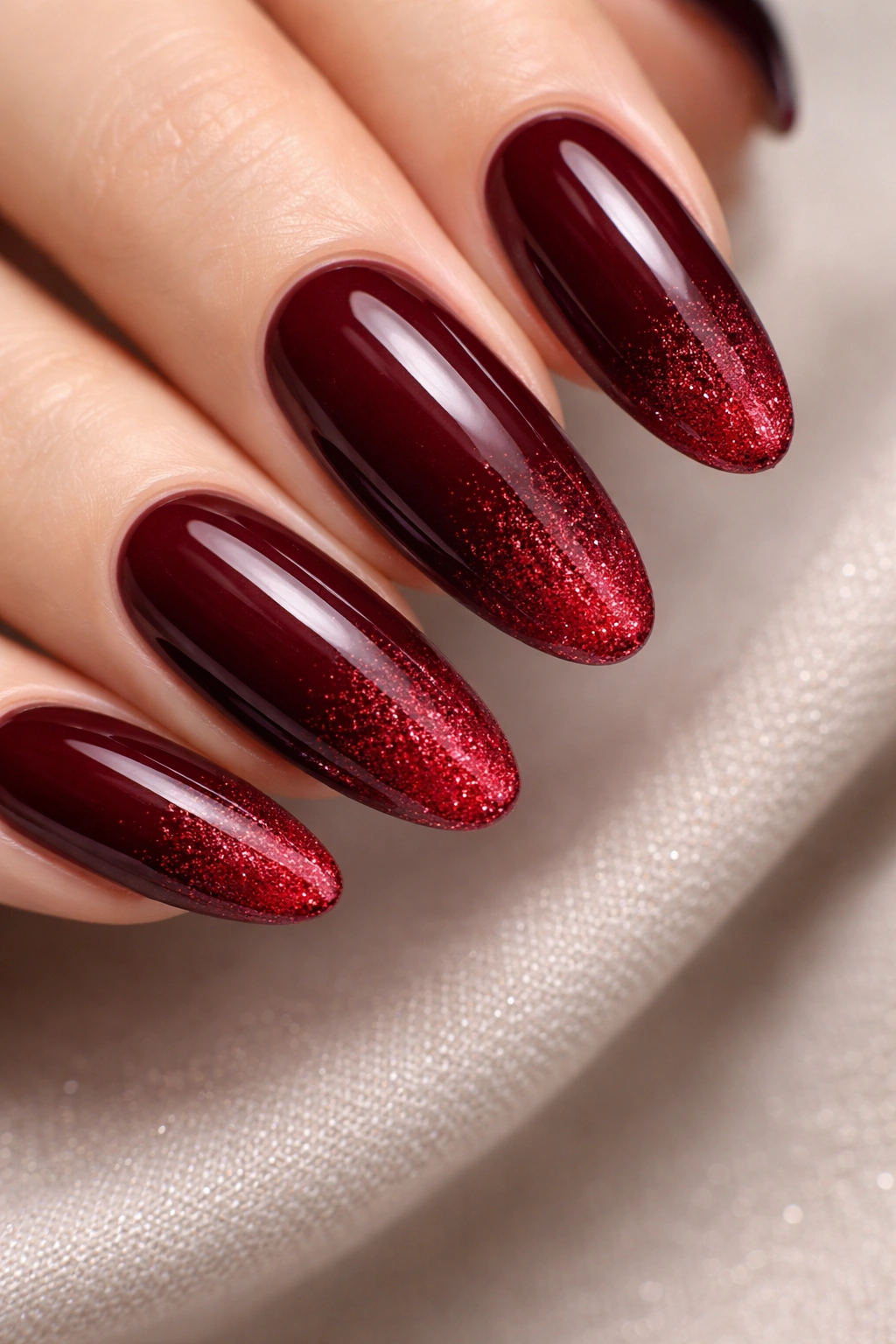 Burgundy nails with subtle red glitter gradient