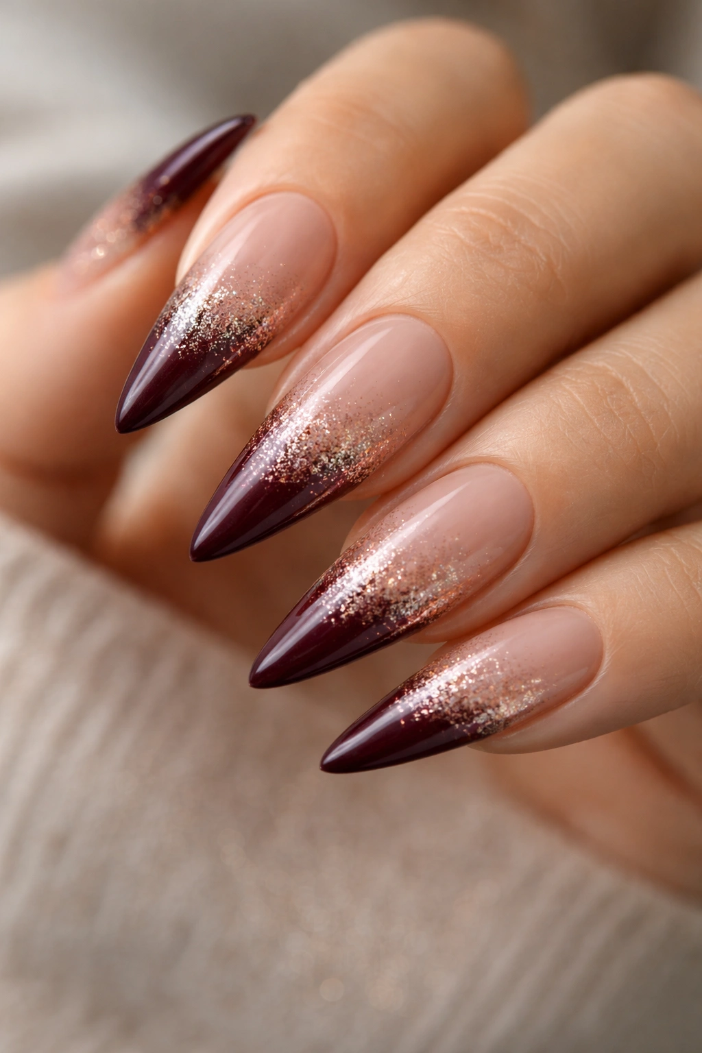 Burgundy tips with rose gold glitter gradient