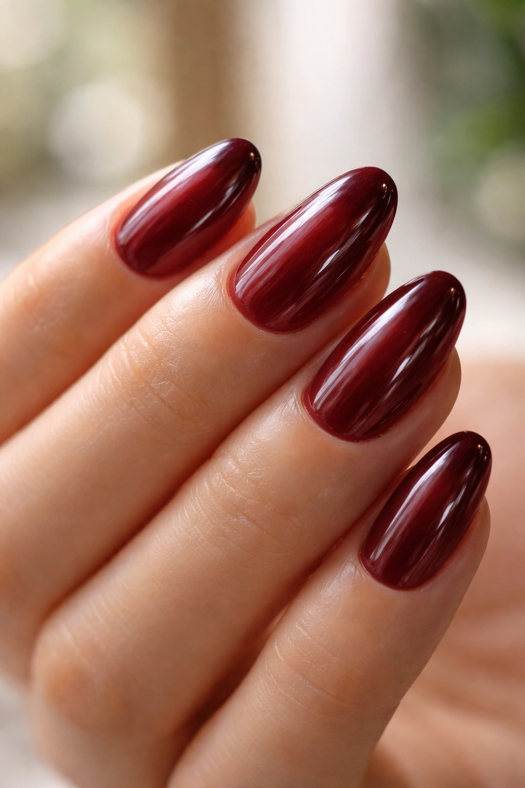 Burgundy jelly nails on short almond nails showing translucency