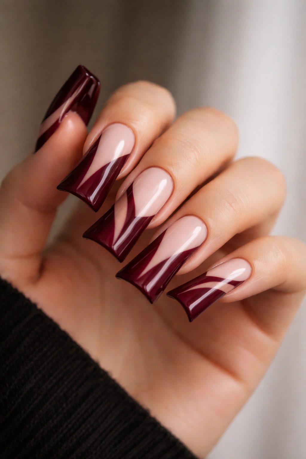 Deep burgundy duck nails with negative space design