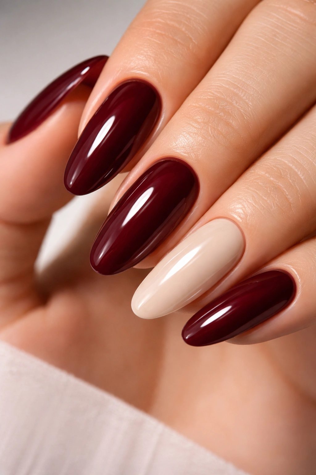 Burgundy nails with nude accent on long ovals