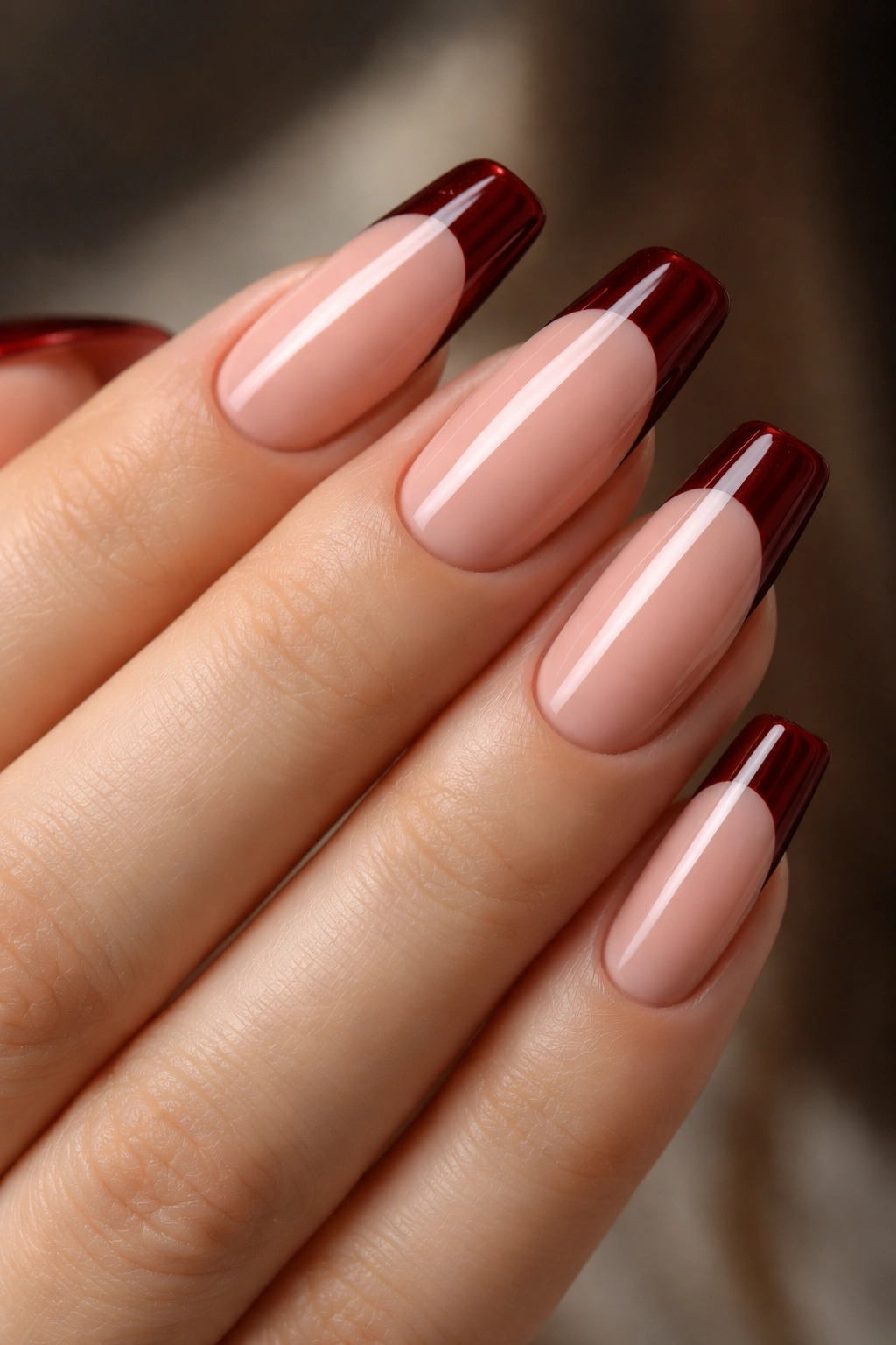 Nails with burgundy tips on warm nude base