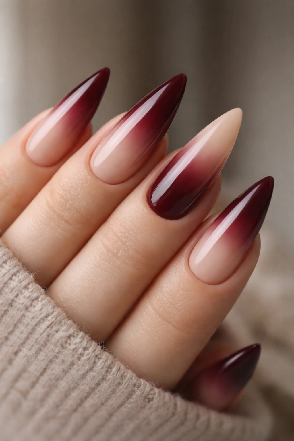 Medium stiletto nails burgundy to nude ombre with smooth gradient