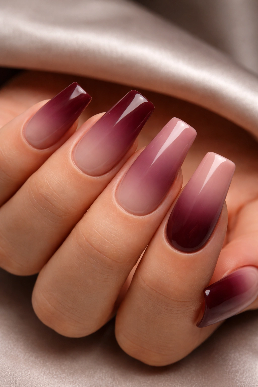 Duck-shaped nails burgundy to nude pink ombre with matte finish.