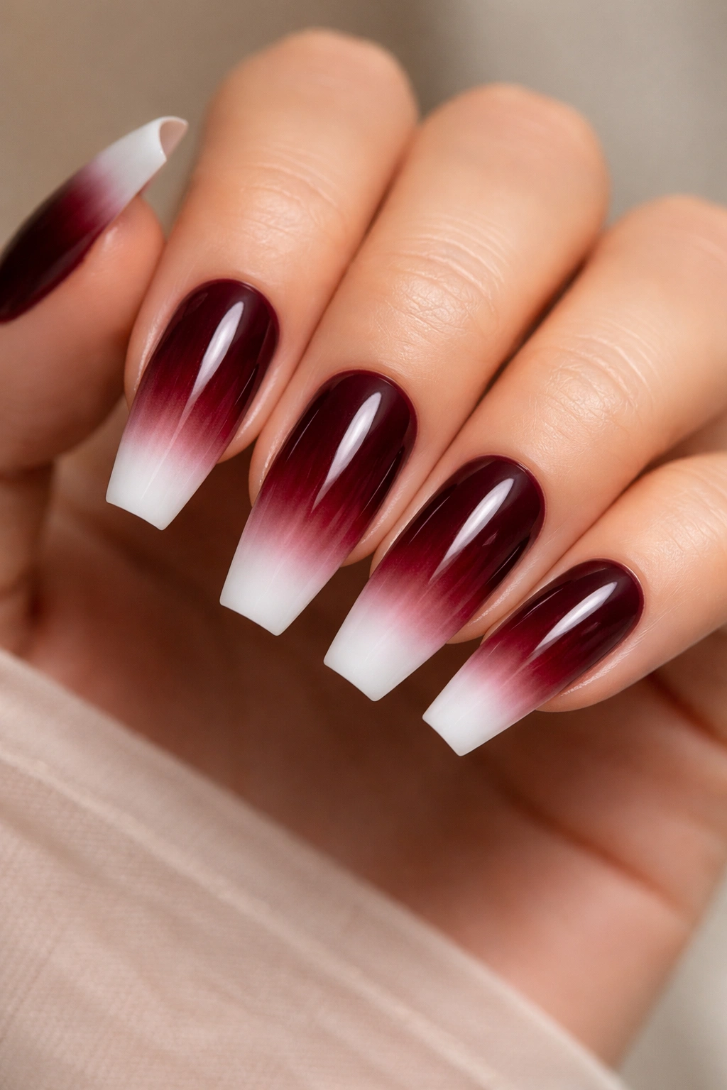Coffin nails showing white tip edge blending into dark burgundy