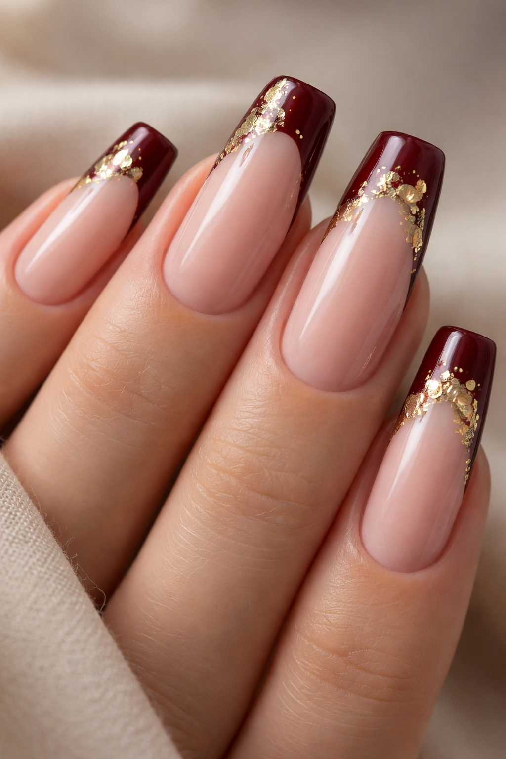 Coffin nails burgundy tips with gold leaf details