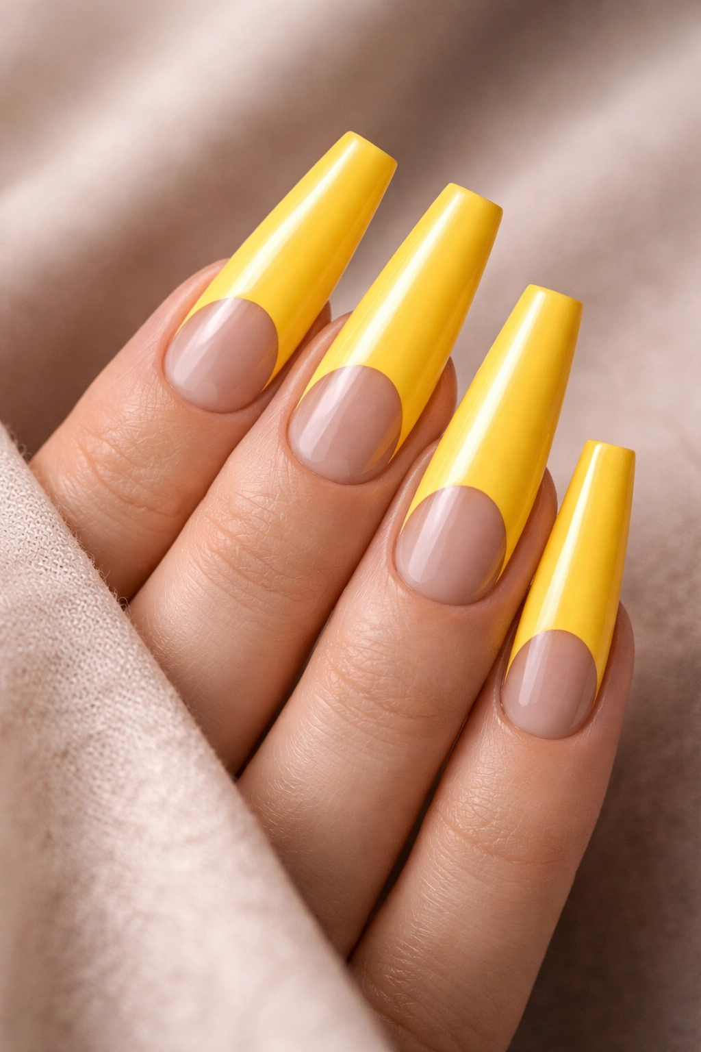 Canary yellow coffin nails with half-moon negative space design