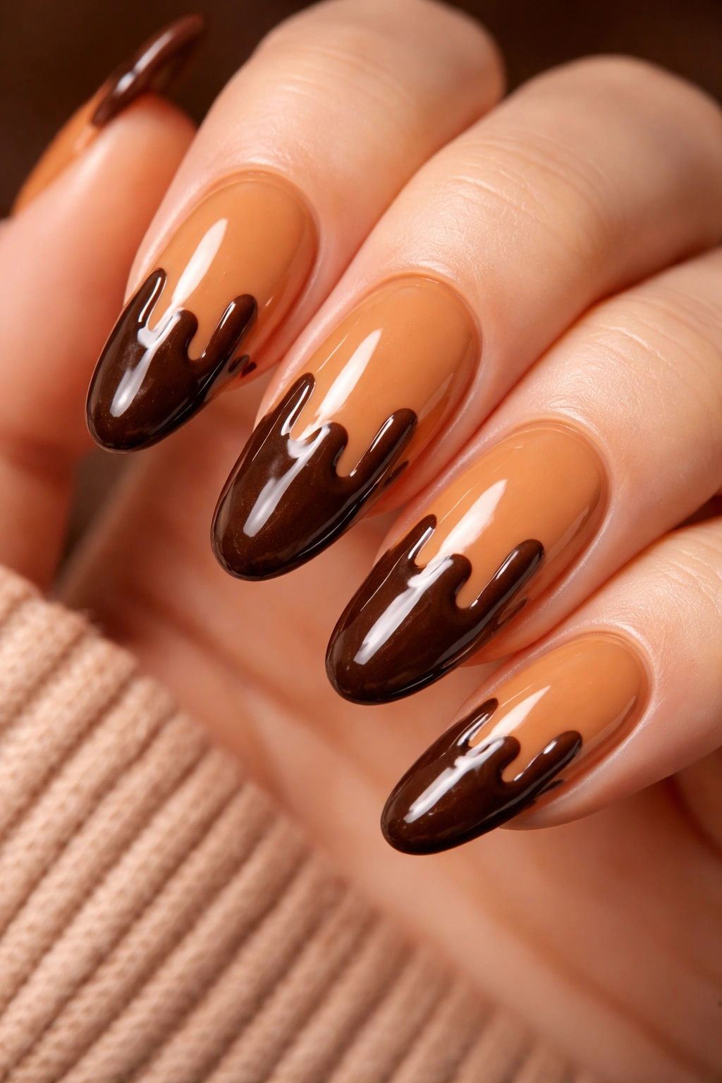Warm caramel nails with chocolate drip effect on long oval nails