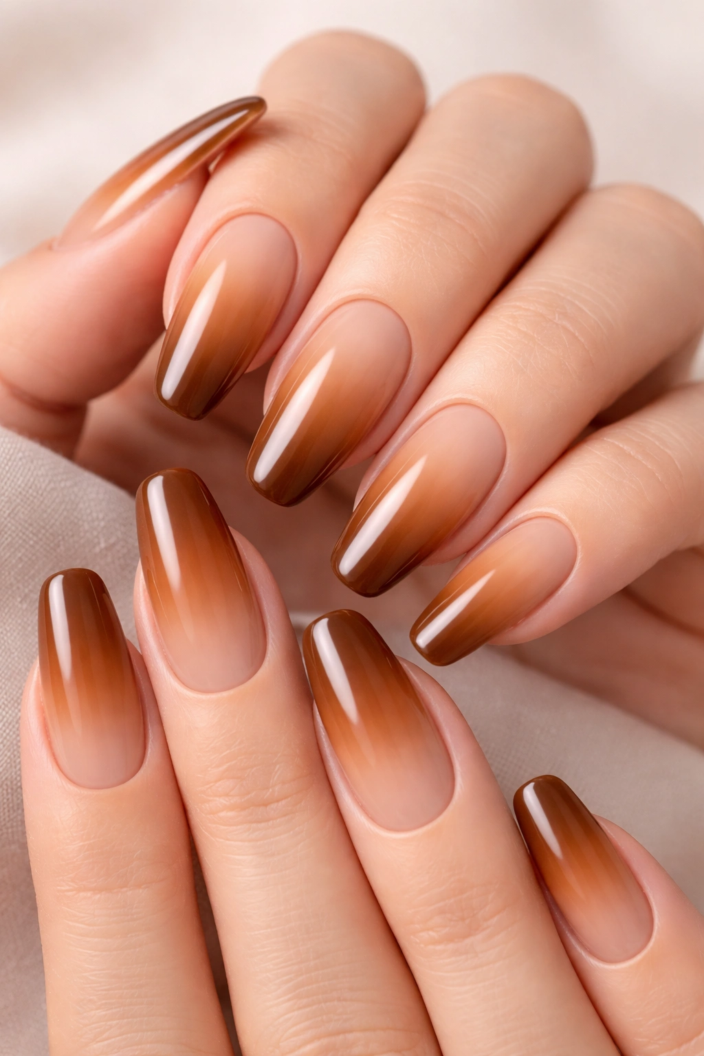 Caramel ombre nails glowing with a smooth gradient