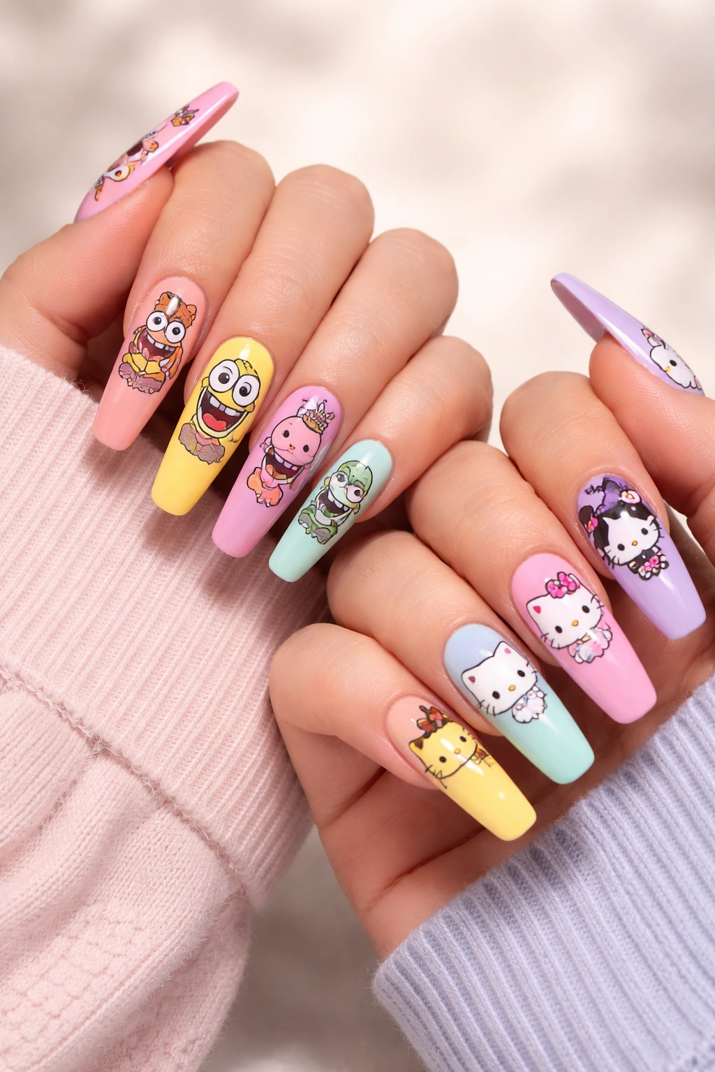Close-up of long nails with minimalist cartoon character designs on two hands