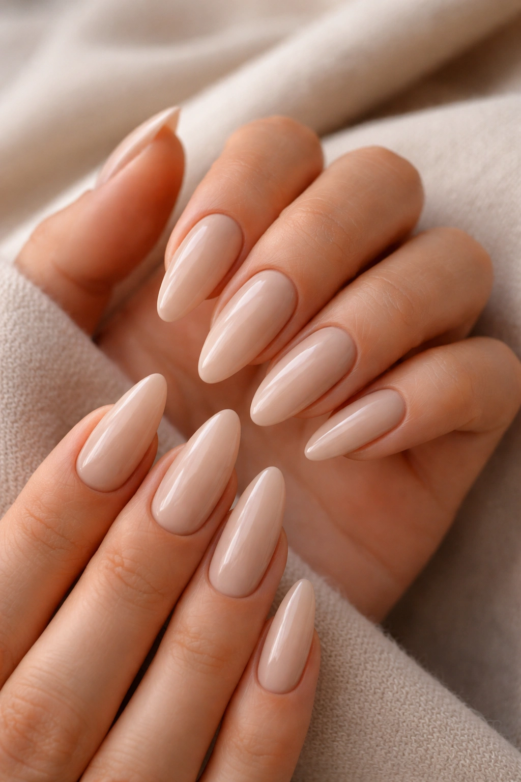 Almond nails in cashmere beige with a glossy finish