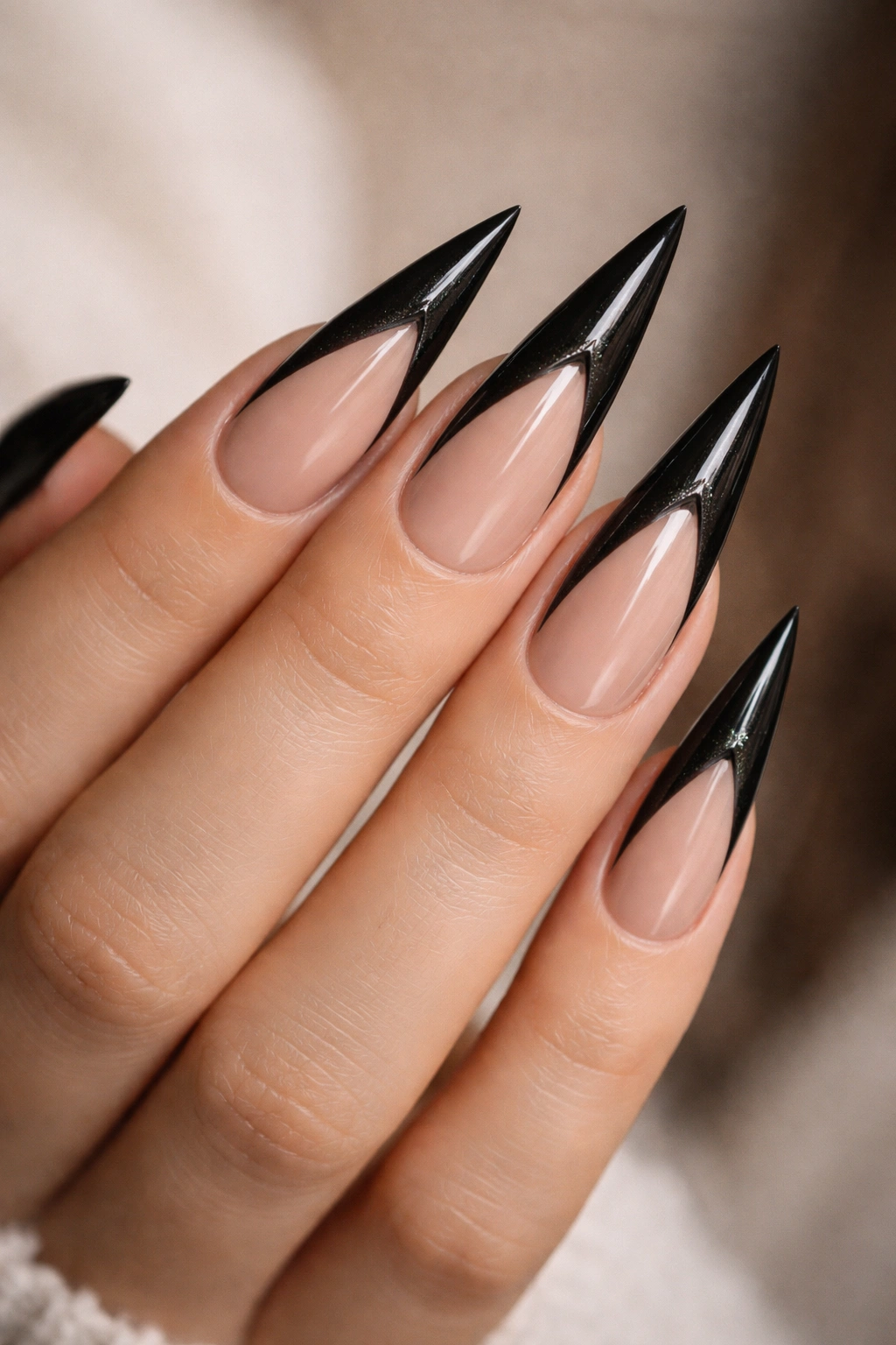 Nude base cat-eye wing design on stiletto nails