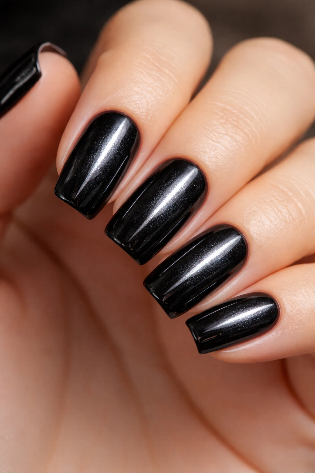Close-up of centered magnet cat-eye nails on short ballerina nails