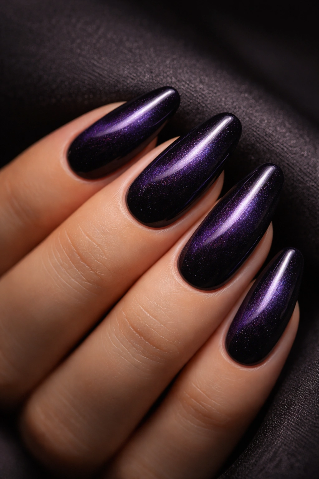 Deep purple cat-eye velvet nails with central stripe