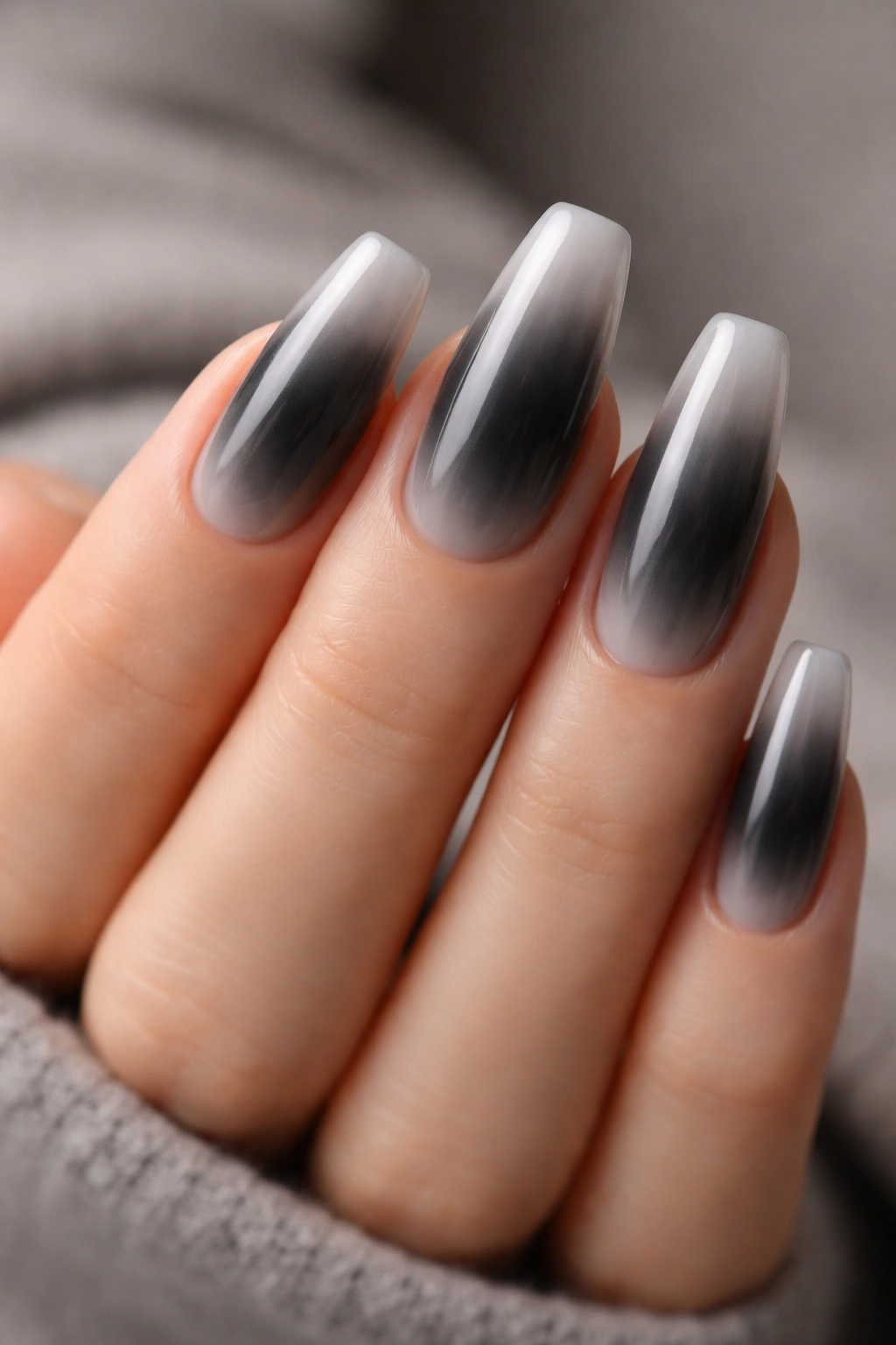 Charcoal aura fade nails with soft smoky center on ballerina shape