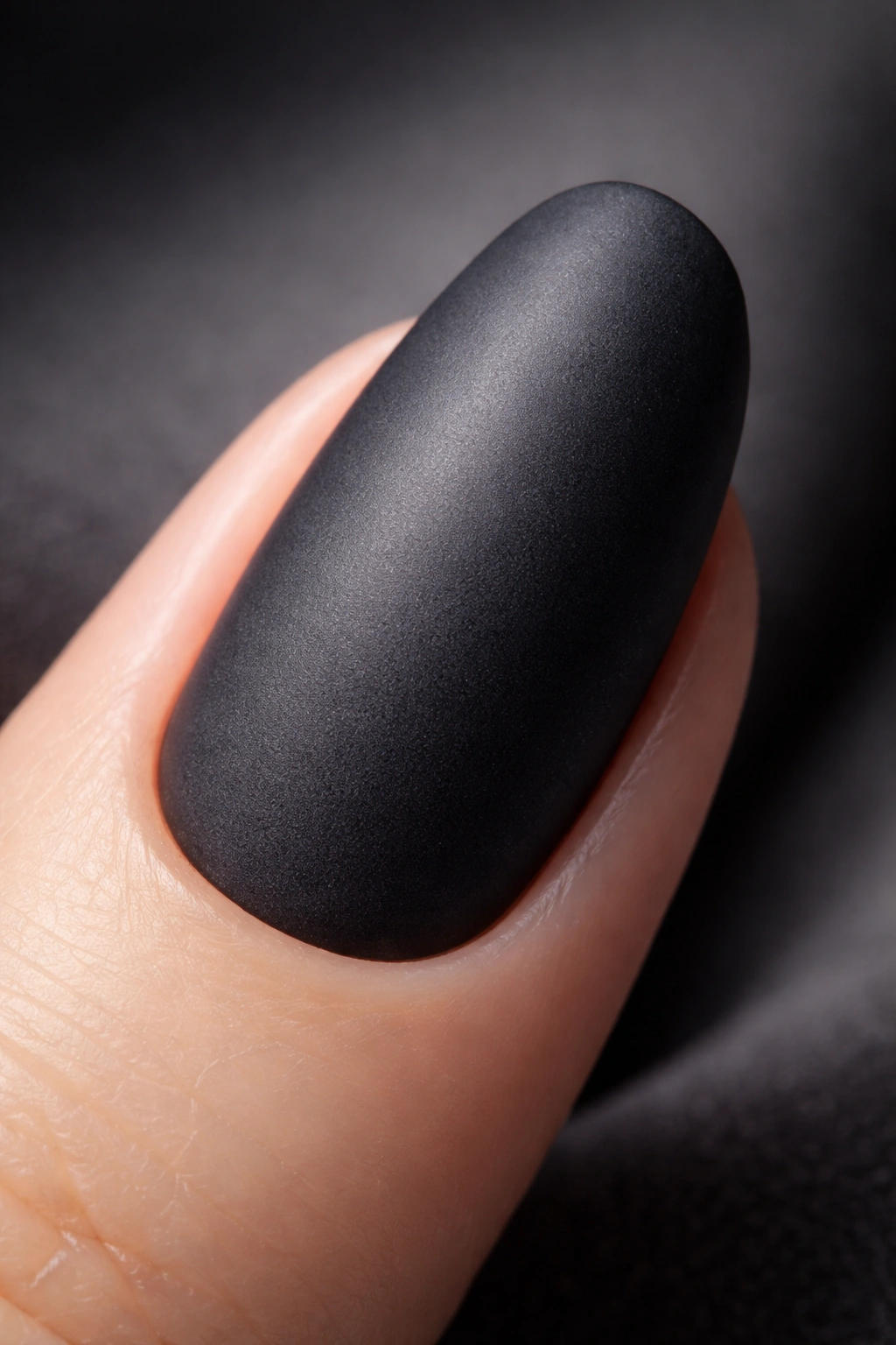 Close-up of charcoal gray matte nail showing velvety texture