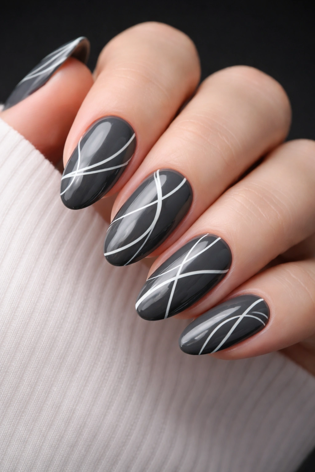 Charcoal grey nails with abstract white line art