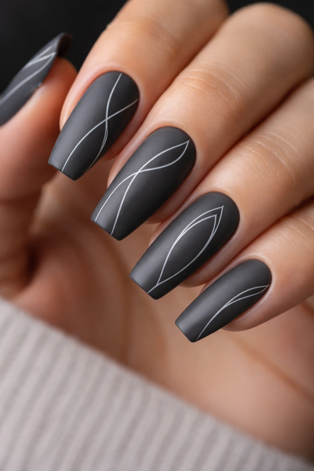 Charcoal gray coffin nails with white minimalist line art