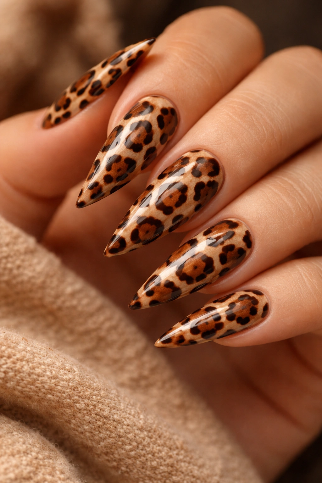 Cheetah spot nails on warm tan stiletto nails