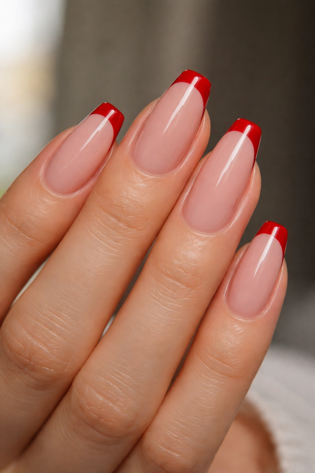 Medium-length ballerina nails with cherry red micro tips on sheer pink base