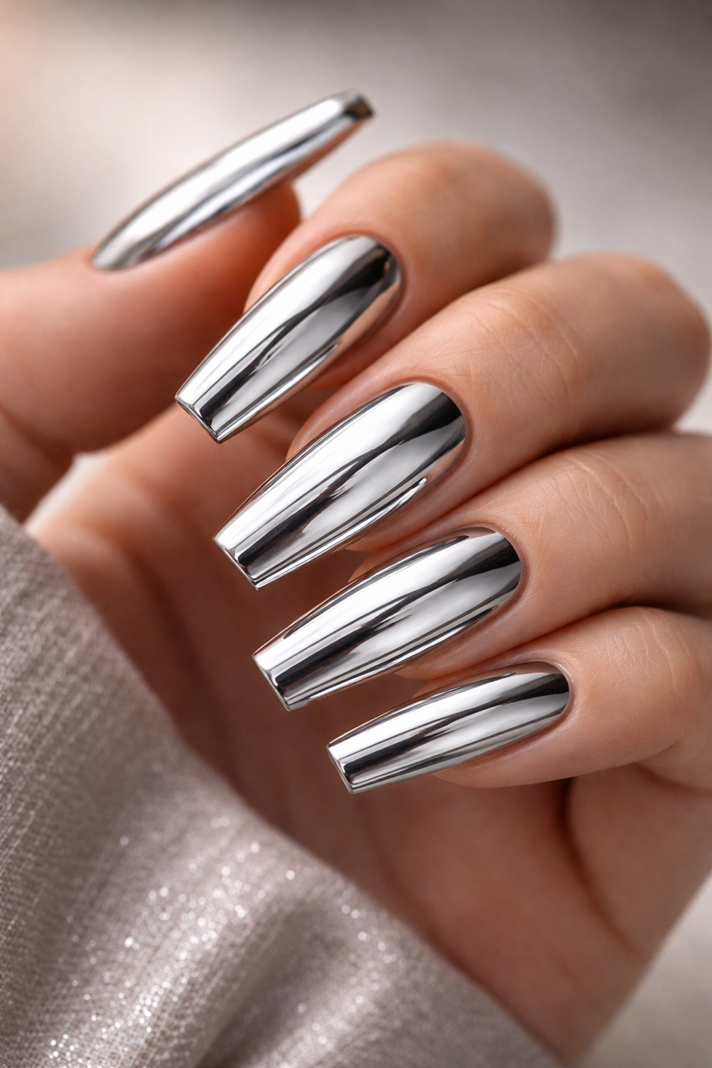 Close-up of coffin nails with chrome mirror finish reflecting light