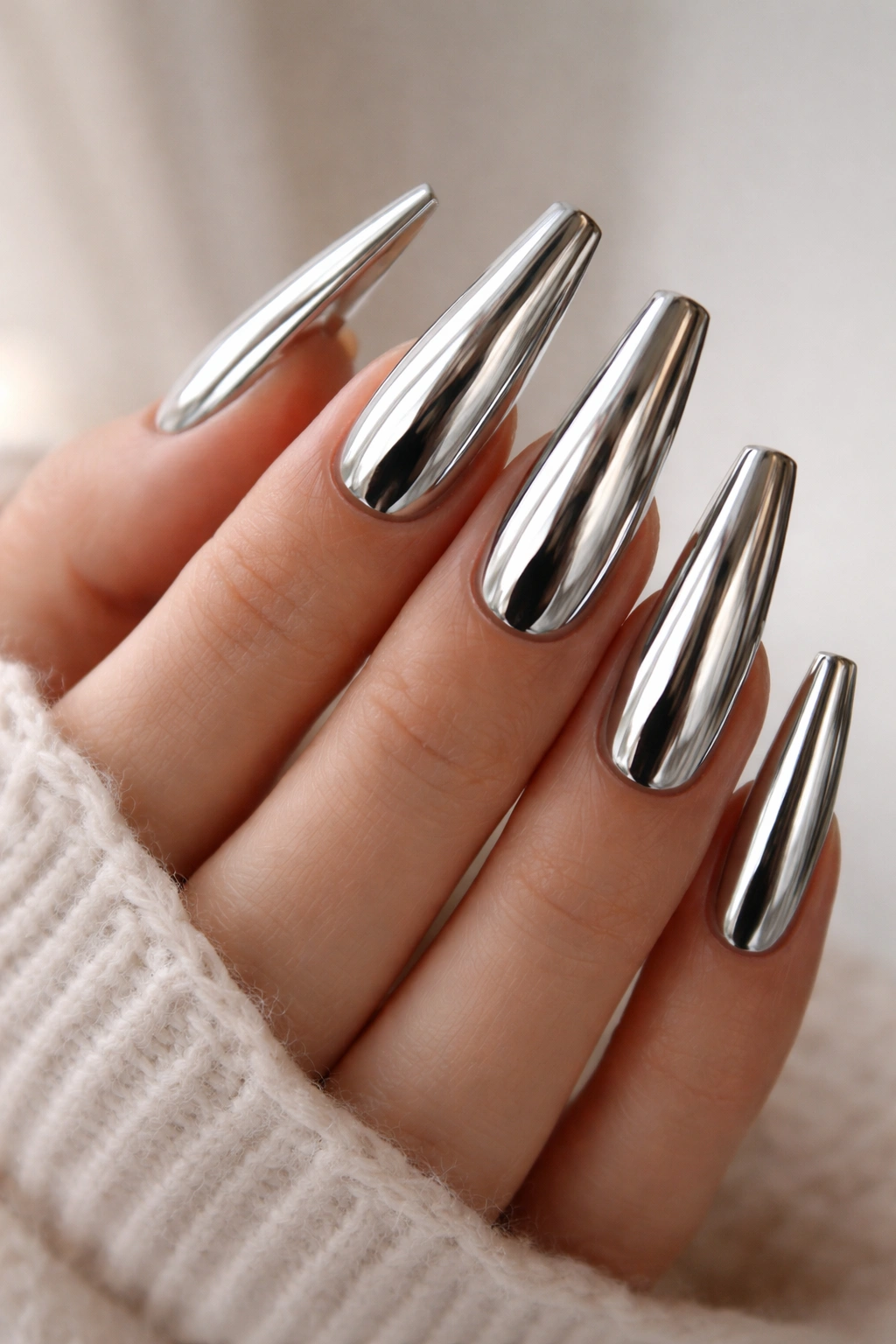 Close-up of coffin nails with metallic chrome mirror finish