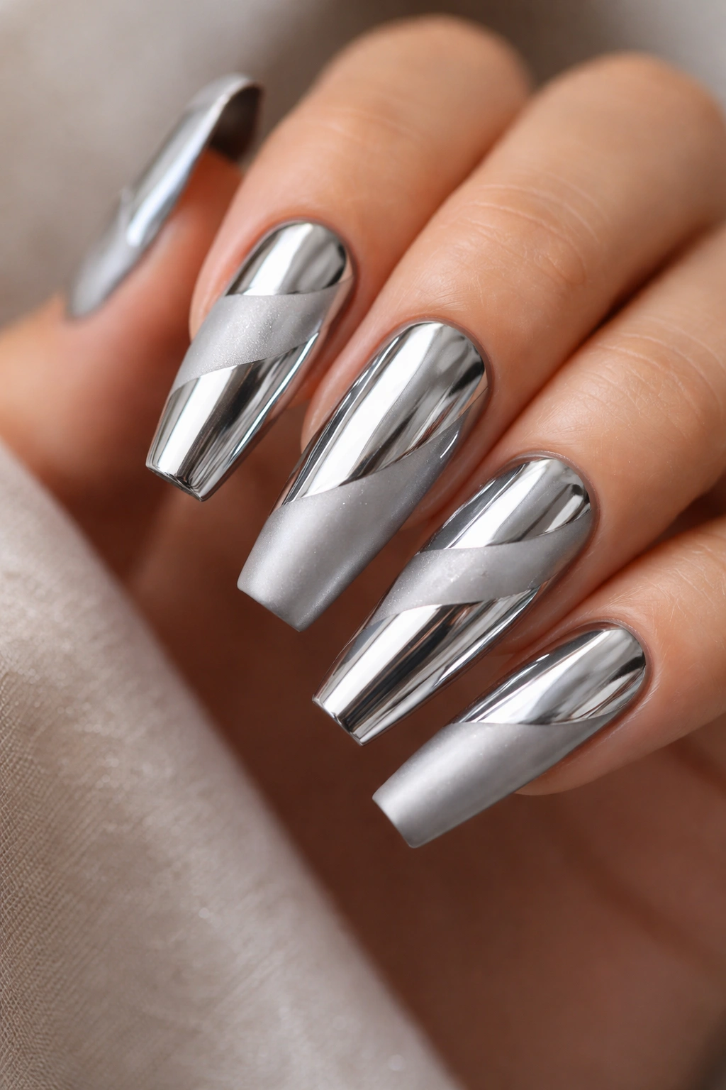 Close-up of coffin nails with full chrome and matte accent finishes