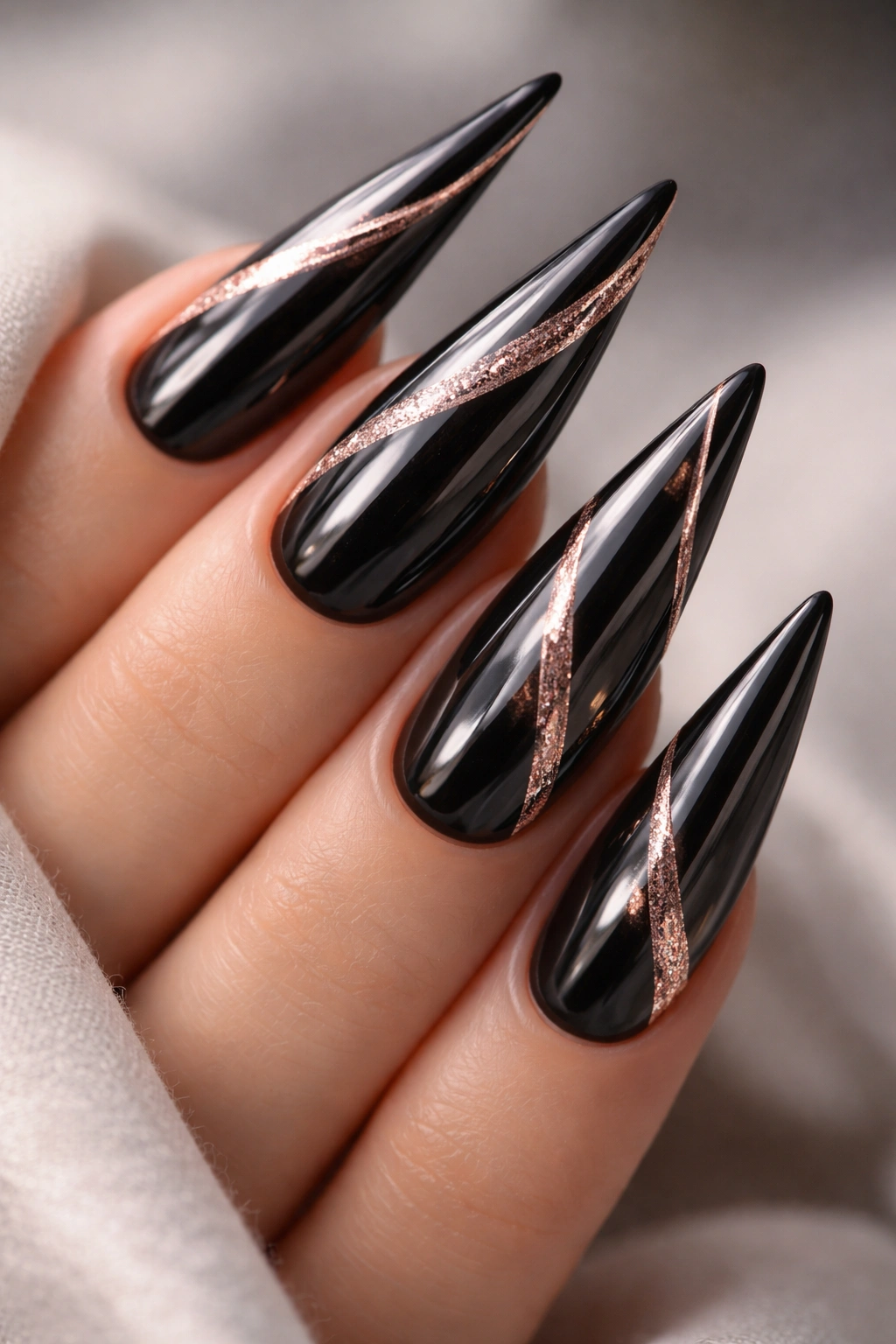 Black chrome nails with rose gold details