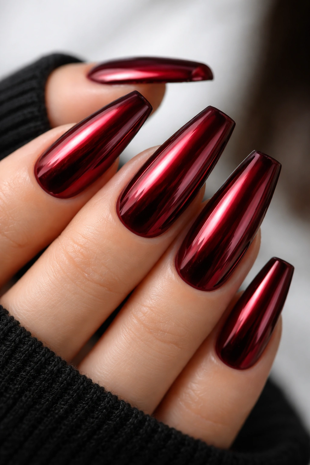 Dark red chrome ballerina nails with reflective chrome over dark red base