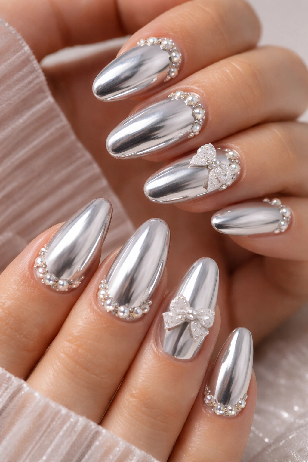 Chrome nails with rhinestones and pearl accents