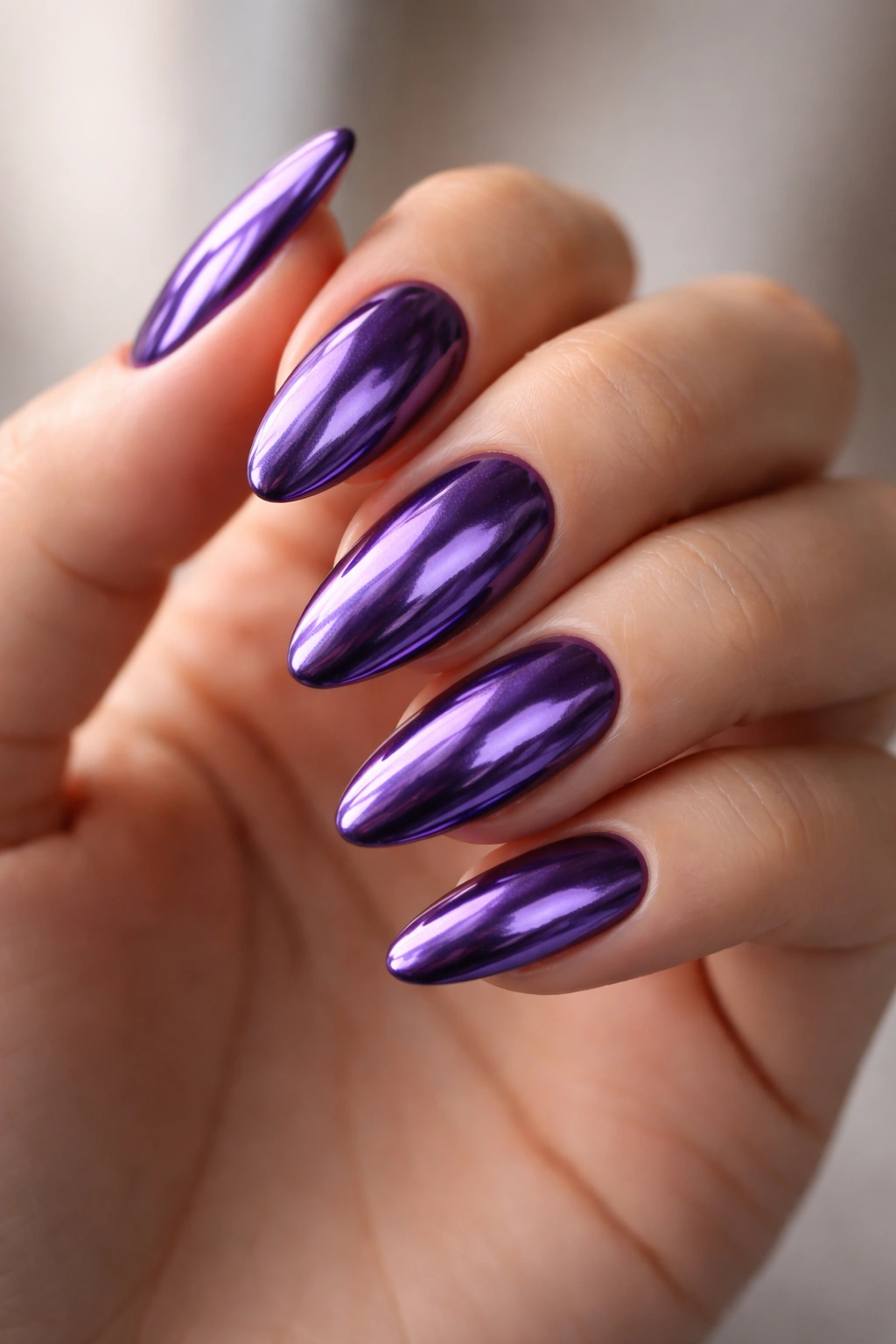 Chrome purple almond nails with reflective metallic finish