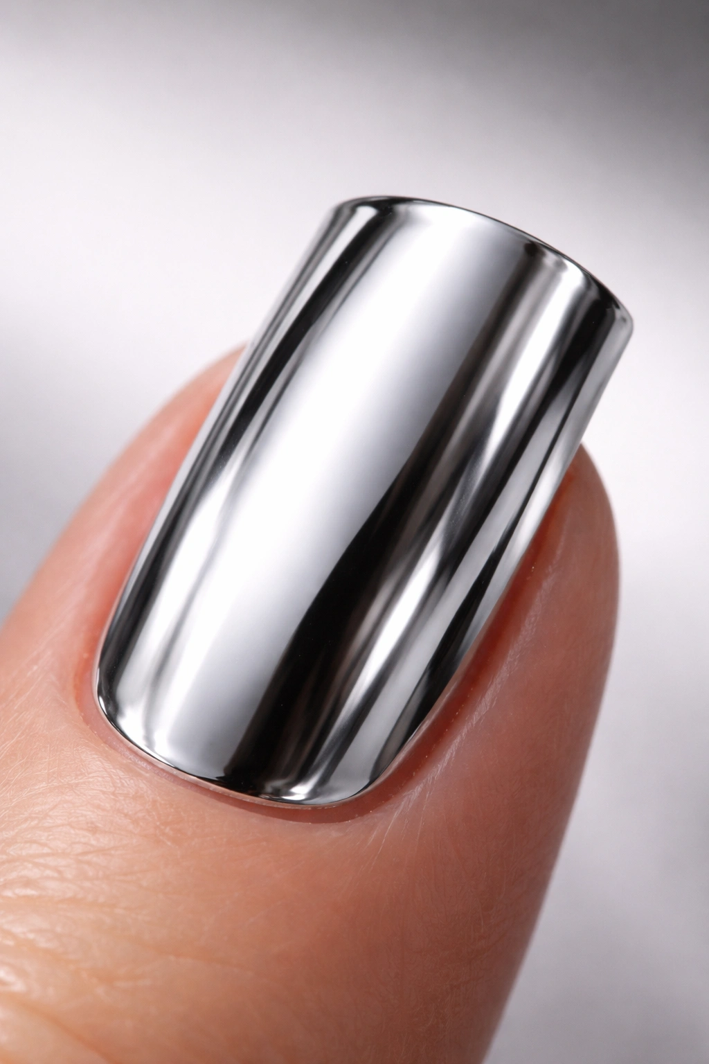 Close-up of a duck nail with a mirror-like chrome silver base.