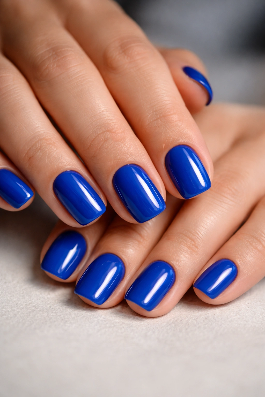 Cobalt blue squoval nails with high-gloss finish