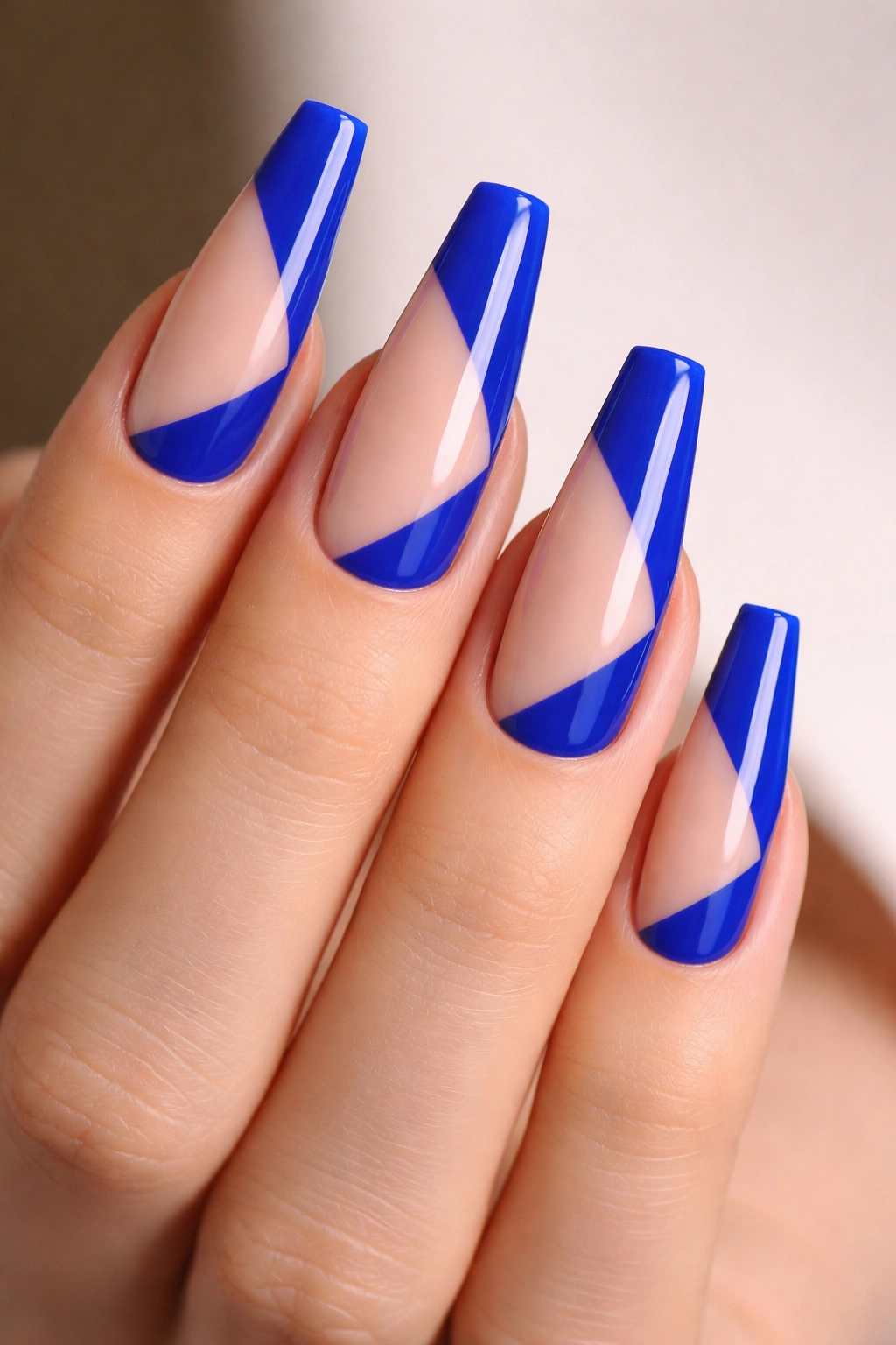 Cobalt nails with negative space geometric color blocks on ballerina shape