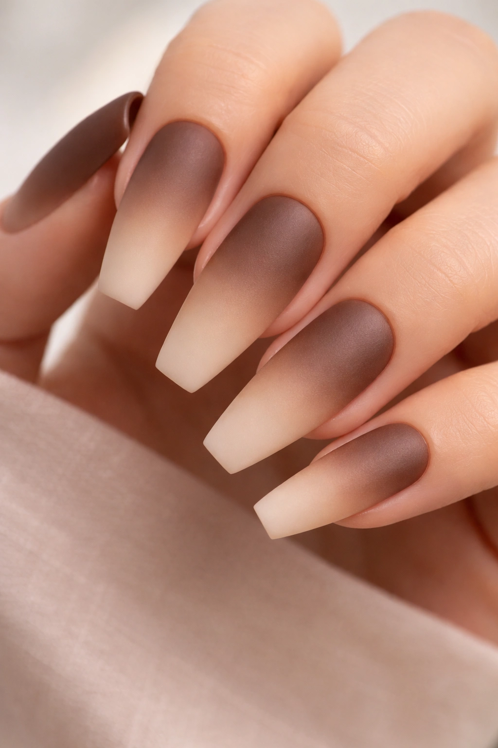 Cocoa brown to almond beige matte ombre on tapered ballerina nails